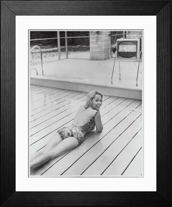 Framed Print : Young Woman Relaxing on Swimming Pool Lift