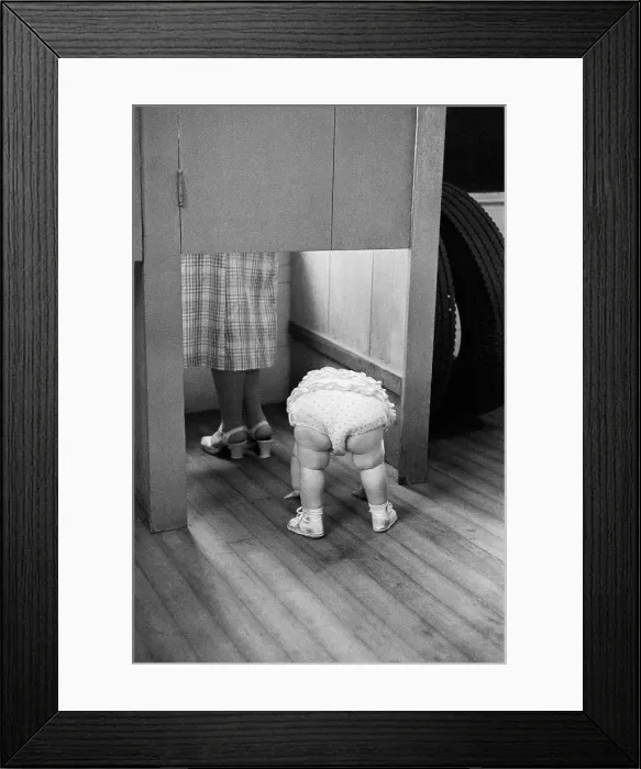 Framed Print : Child Peeking Under Voting Booth Framed Print : Child Peeking Under Voting Booth
