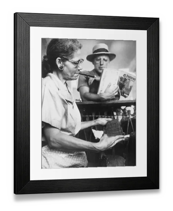 Framed Print : Woman Smoking and Rolling Cigars at Factory Framed Print : Woman Smoking and Rolling Cigars at Factory