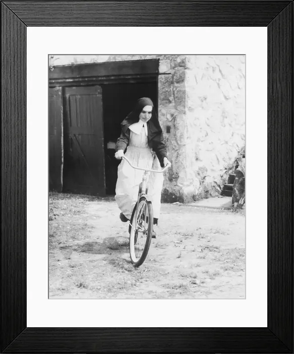 Framed Print : Nun on a Bike Framed Print : Nun on a Bike