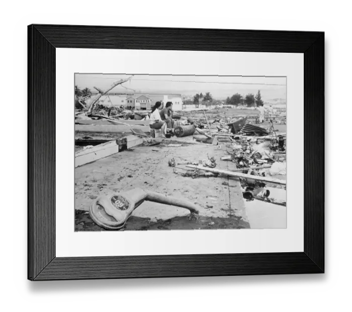 Framed Print : Young Couple Kneeling at Debris of Storm Ridden Settlement Framed Print : Young Couple Kneeling at Debris of Storm Ridden Settlement