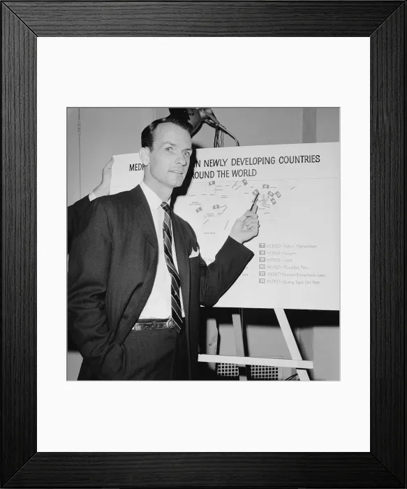 Framed Print : Tom Dooley Pointing to a Chart Framed Print : Tom Dooley Pointing to a Chart