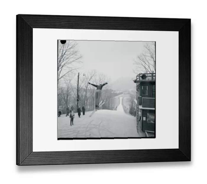 Framed Print : Art Devlin Performing a Ski Jump
