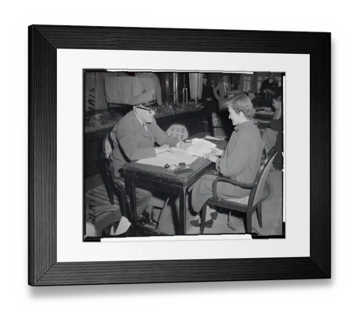 Framed Print : Inspecting a Passport Framed Print : Inspecting a Passport