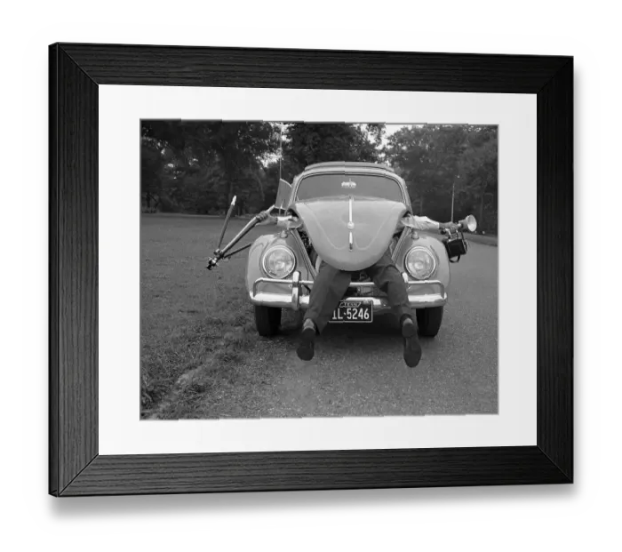 Framed Print : Photographer Sticking Out of VW Beetle
