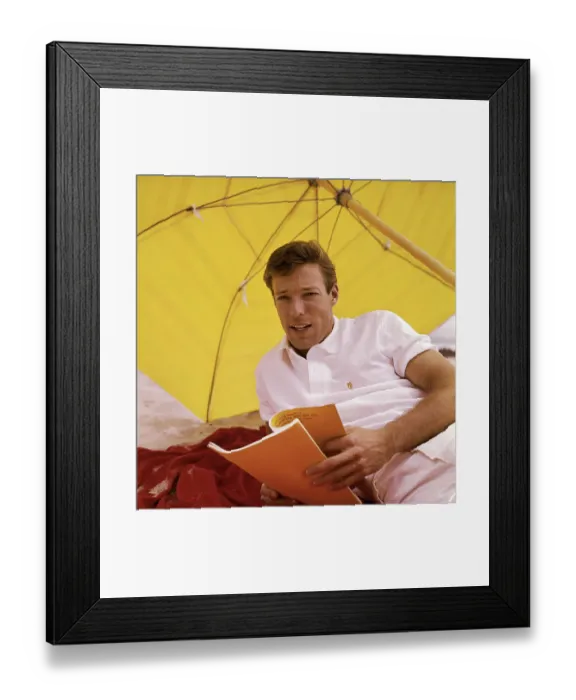 Framed Print : Richard Chamberlain Shielded by Yellow Umbrella Framed Print : Richard Chamberlain Shielded by Yellow Umbrella