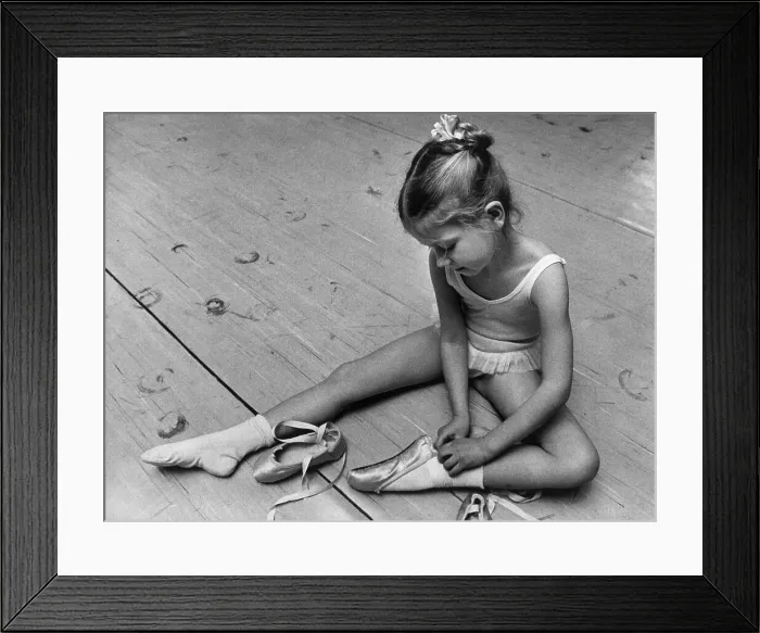 Framed Print : Girl Putting On Ballet Slippers Framed Print : Girl Putting On Ballet Slippers