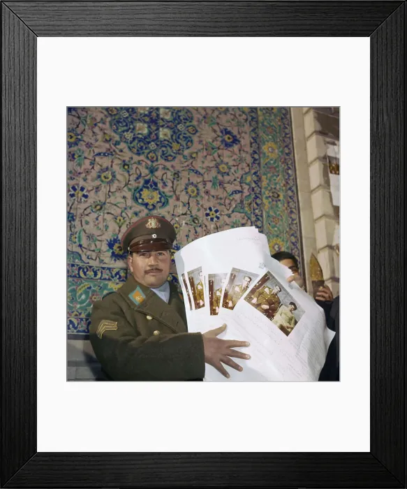 Framed Print : Iranian Officer Displaying Documents Framed Print : Iranian Officer Displaying Documents