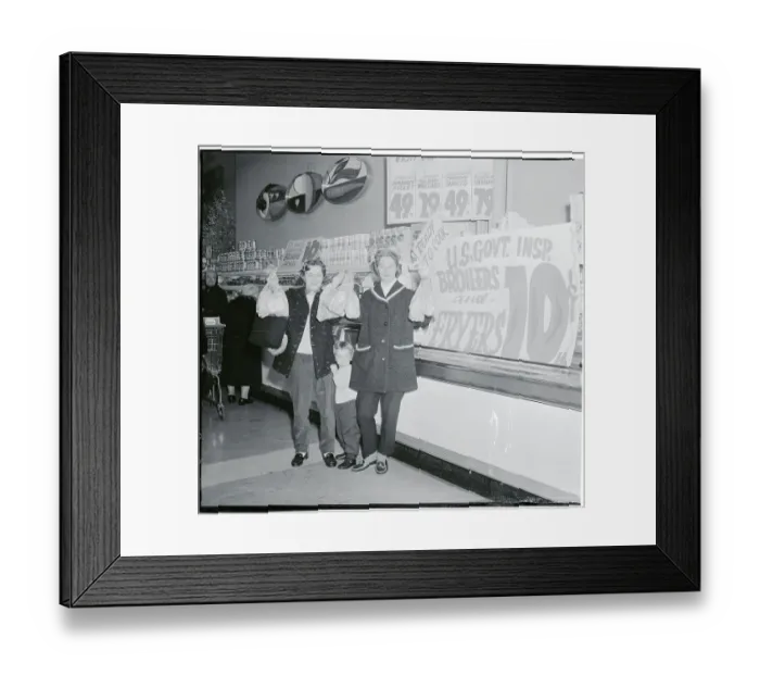 Framed Print : Woman Holding up Chickens Framed Print : Woman Holding up Chickens