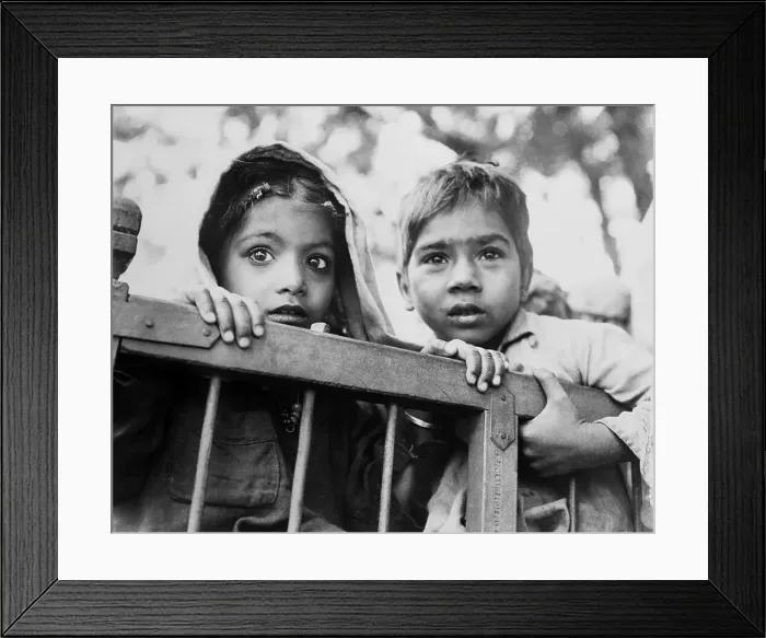 Framed Print : Two Young Indian Children Holding to Side of Cart