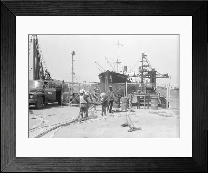 Framed Print : Monrovia Dock Workers near Large Ship Framed Print : Monrovia Dock Workers near Large Ship