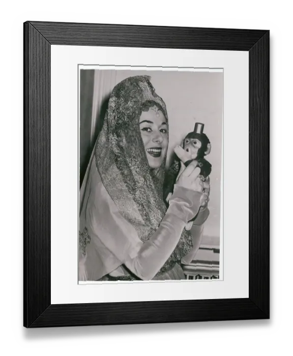 Framed Print : Antonietta Stella Holding Toy Monkey Framed Print : Antonietta Stella Holding Toy Monkey