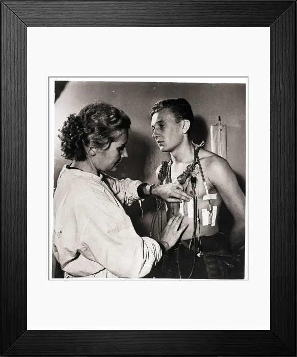 Framed Print : Cosmonaut Getting Sensors Taped to Chest Framed Print : Cosmonaut Getting Sensors Taped to Chest