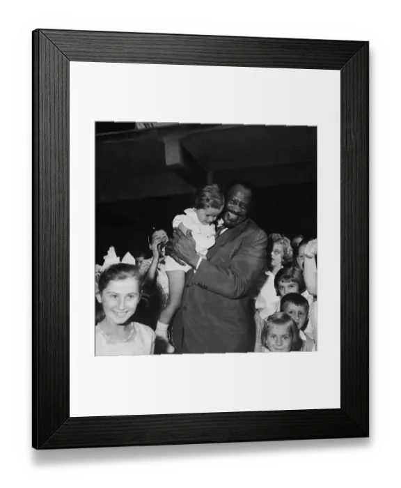 Framed Print : Paul Robeson Holding Young Child Near Group of Children Framed Print : Paul Robeson Holding Young Child Near Group of Children