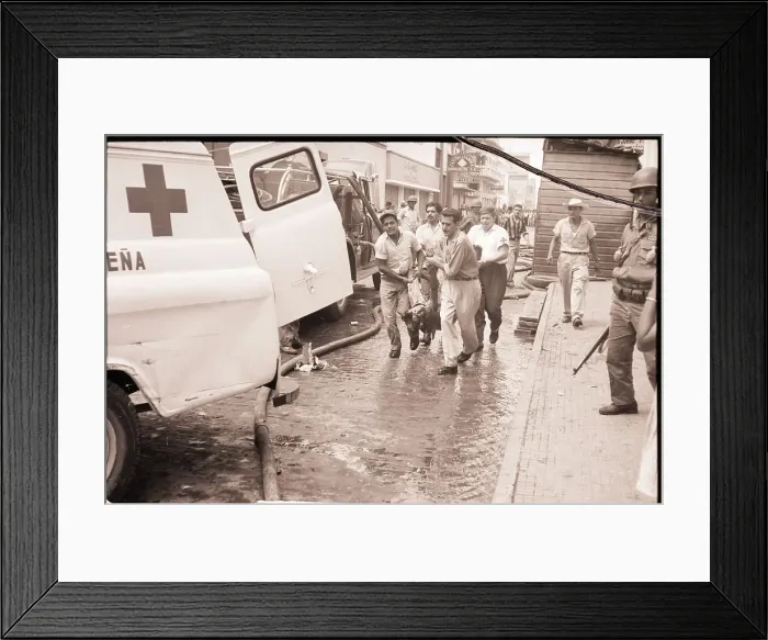 Framed Print : Men Carry Victim to Ambulance on Street Framed Print : Men Carry Victim to Ambulance on Street
