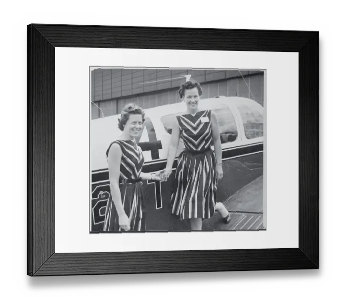 Framed Print : Female Pilots Posing Next to Their Plane Framed Print : Female Pilots Posing Next to Their Plane
