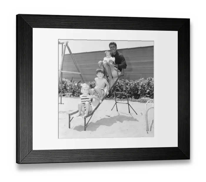 Framed Print : Peter Lawford with Children on Slide Framed Print : Peter Lawford with Children on Slide
