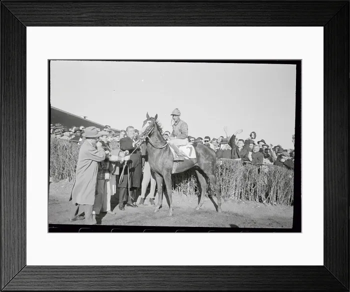 Framed Print : Eddie Arcaro Posing on Atoll with Crowd Cheering Framed Print : Eddie Arcaro Posing on Atoll with Crowd Cheering