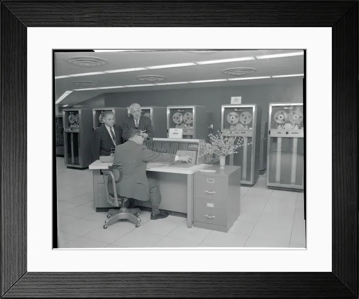 Framed Print : Men Looking Over Computer Printouts Framed Print : Men Looking Over Computer Printouts