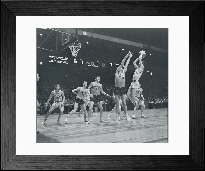 Framed Print : Manhattan and Syracuse Players Playing Hard on the Court Framed Print : Manhattan and Syracuse Players Playing Hard on the Court