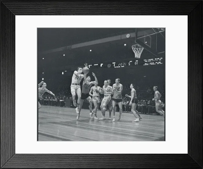 Framed Print : Manhattan and Syracuse Players Playing Hard on the Court Framed Print : Manhattan and Syracuse Players Playing Hard on the Court