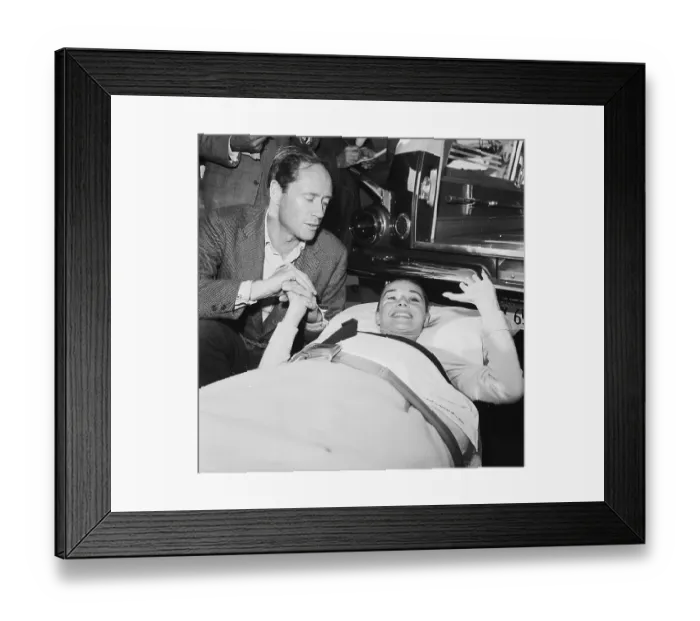 Framed Print : Mel Ferrer Holding Hands with Injured Audrey Hepburn Framed Print : Mel Ferrer Holding Hands with Injured Audrey Hepburn