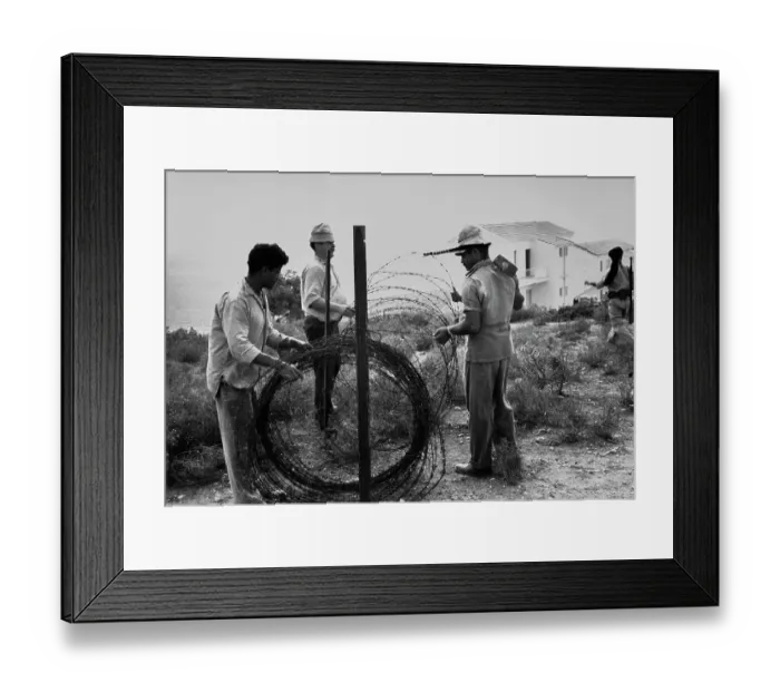 Framed Print : Building A Barbed Wire Fence