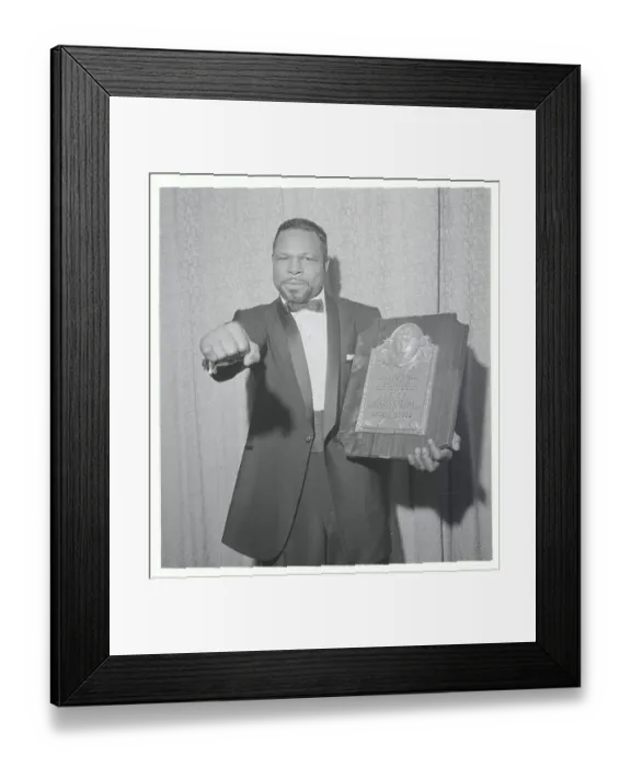 Framed Print : Boxer Archie Moore Making Fist and Holding Plaque