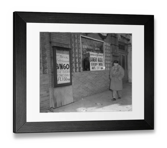 Framed Print : Man Strolls Past Where Bingo Is Played Framed Print : Man Strolls Past Where Bingo Is Played