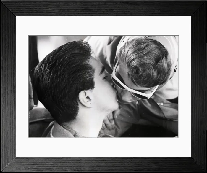 Framed Print : Teenage Race Driver Kisses Mother