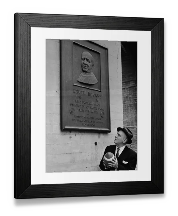 Framed Print : Pat O'Brien Holding Football and Looking at Wall Plaque Framed Print : Pat O'Brien Holding Football and Looking at Wall Plaque