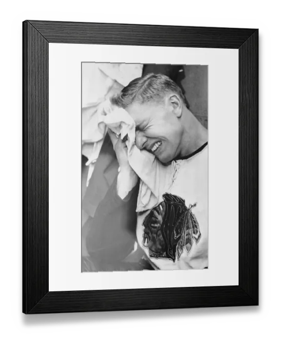 Framed Print : Hockey Player Bobby Hull Holding Ice on Eye Framed Print : Hockey Player Bobby Hull Holding Ice on Eye