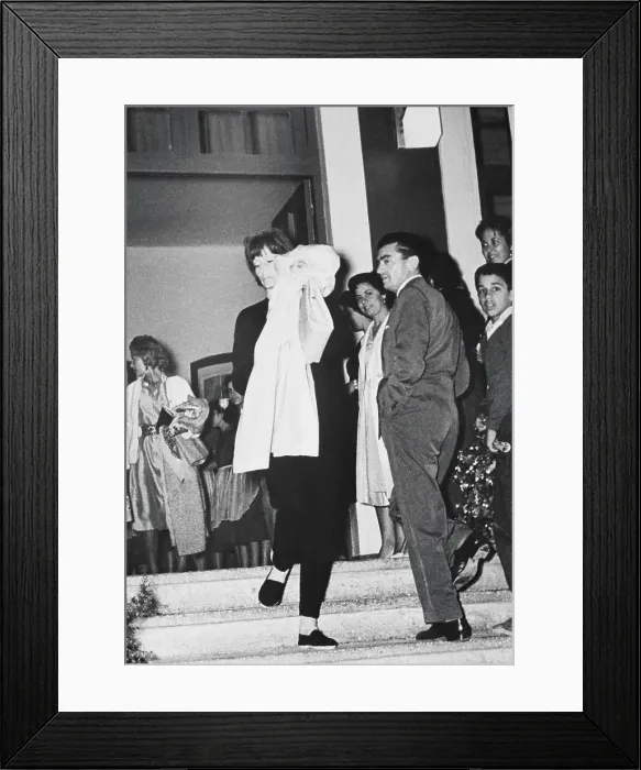 Framed Print : Actress Greta Garbo Hiding Her Face While Exiting Restaurant Framed Print : Actress Greta Garbo Hiding Her Face While Exiting Restaurant