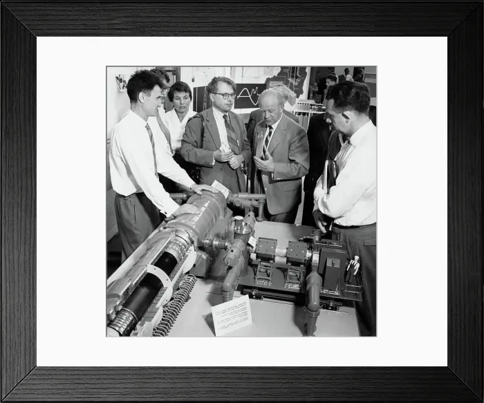 Framed Print : Scientist at Atomic Energy Conference Exhibit
