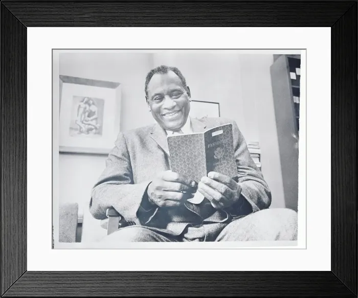 Framed Print : Paul Robeson Examining His Passport