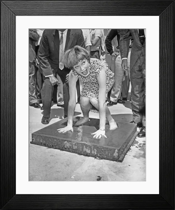 Framed Print : Shirley MacLaine Placing Hands in Wet Cement Framed Print : Shirley MacLaine Placing Hands in Wet Cement