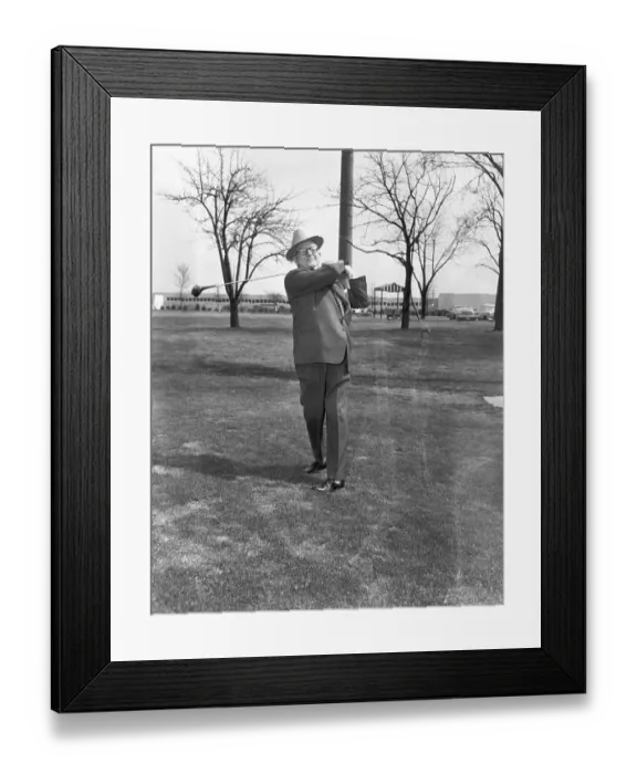 Framed Print : George May in Suit Swinging Golf Club