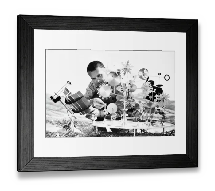 Framed Print : Charles Eames with Kinetic Metal Sculpture Framed Print : Charles Eames with Kinetic Metal Sculpture