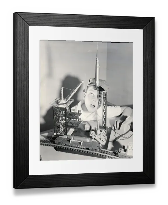 Framed Print : Boy Playing With Space Age Rocket Toys Framed Print : Boy Playing With Space Age Rocket Toys