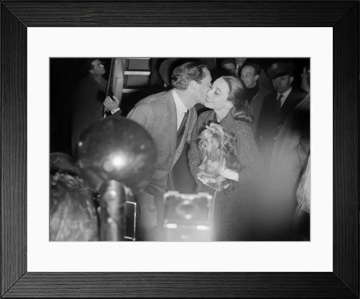 Framed Print : Mel Ferrer Kissing Audrey Hepburn at Airport Framed Print : Mel Ferrer Kissing Audrey Hepburn at Airport