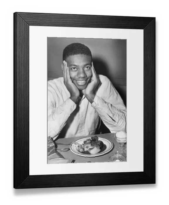Framed Print : Oscar Robertson Smiling Over Food Framed Print : Oscar Robertson Smiling Over Food