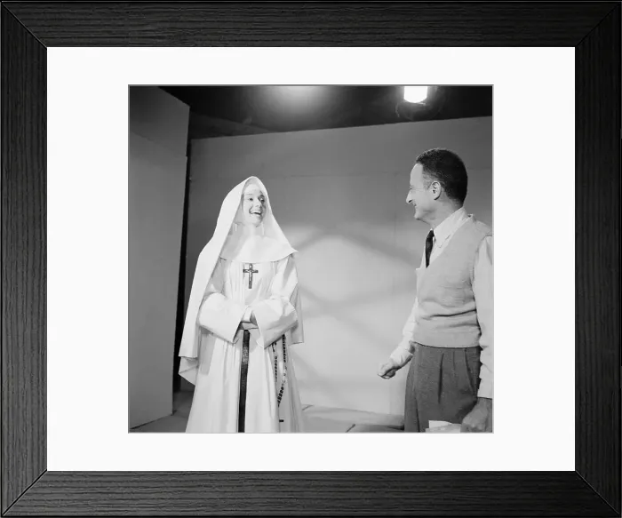 Framed Print : Audrey Hepburn with Fred Zinnemann of The Nun's Story Framed Print : Audrey Hepburn with Fred Zinnemann of The Nun's Story