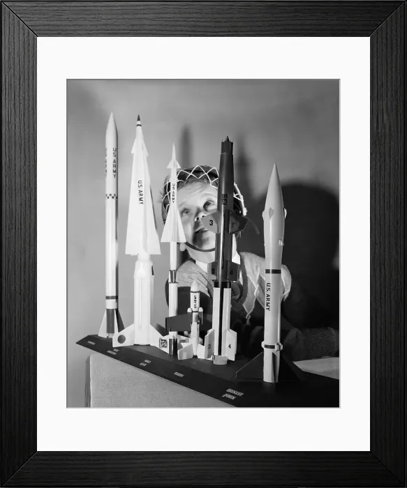 Framed Print : Boy Playing With Space Age Rocket Toys Framed Print : Boy Playing With Space Age Rocket Toys