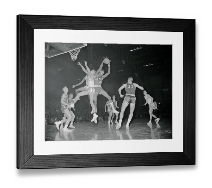 Framed Print : Wilt Chamberlain Leaping over Others Framed Print : Wilt Chamberlain Leaping over Others