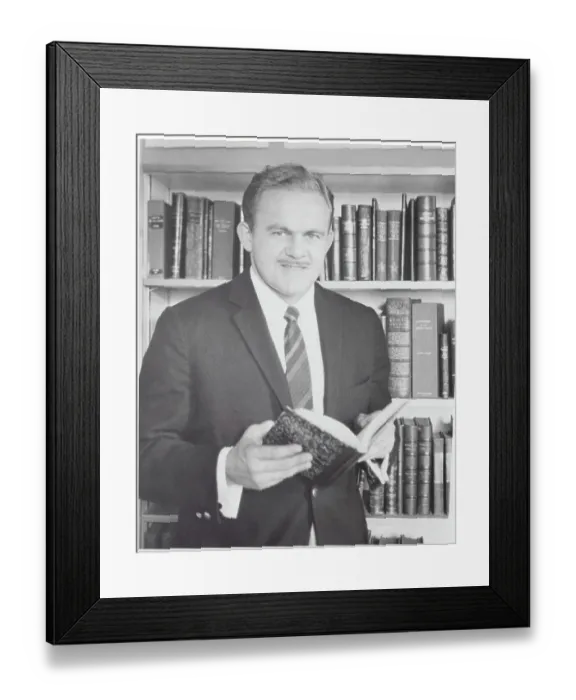 Framed Print : James Jones Holding Book Framed Print : James Jones Holding Book