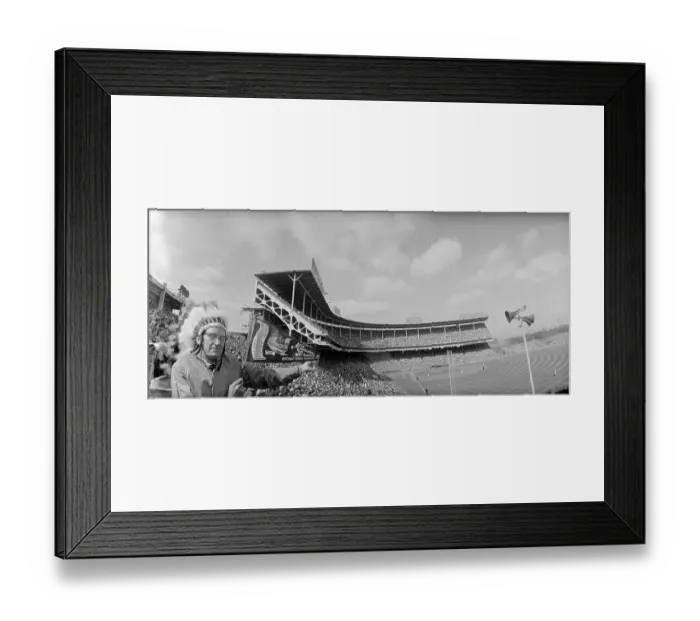 Framed Print : Man Wearing an Indian Headdress at a Stadium Framed Print : Man Wearing an Indian Headdress at a Stadium