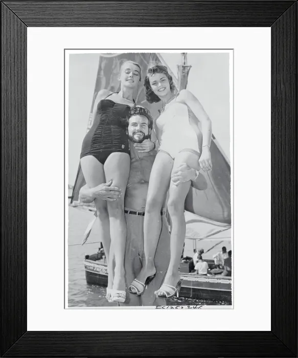 Framed Print : Steve Reeves Posing with Beauty Contestant Winners on Shore