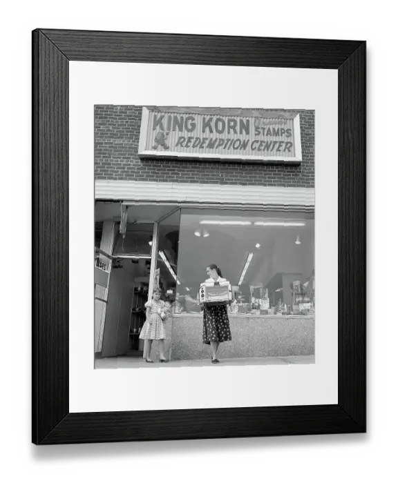Framed Print : Woman and Daughter Leave Store Framed Print : Woman and Daughter Leave Store
