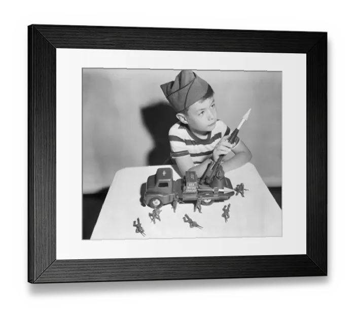 Framed Print : Boy Playing with Toy Missile Launcher and Soldiers Framed Print : Boy Playing with Toy Missile Launcher and Soldiers