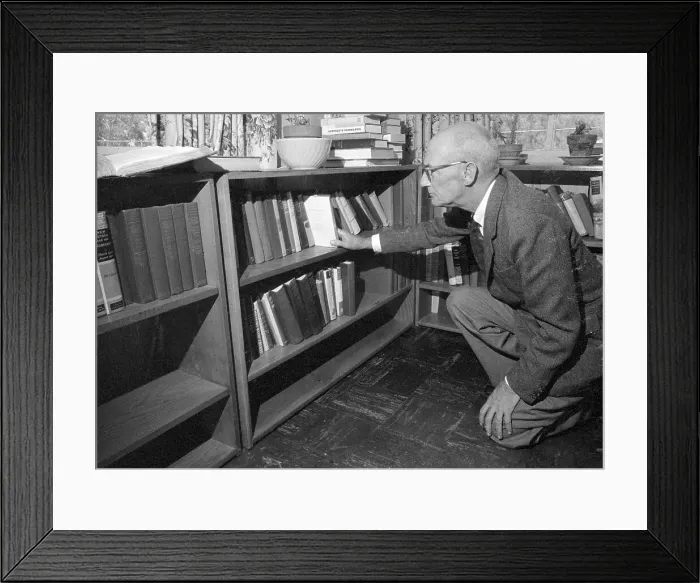 Framed Print : Author C. S. Forester Selecting a Book from Bookshelf Framed Print : Author C. S. Forester Selecting a Book from Bookshelf